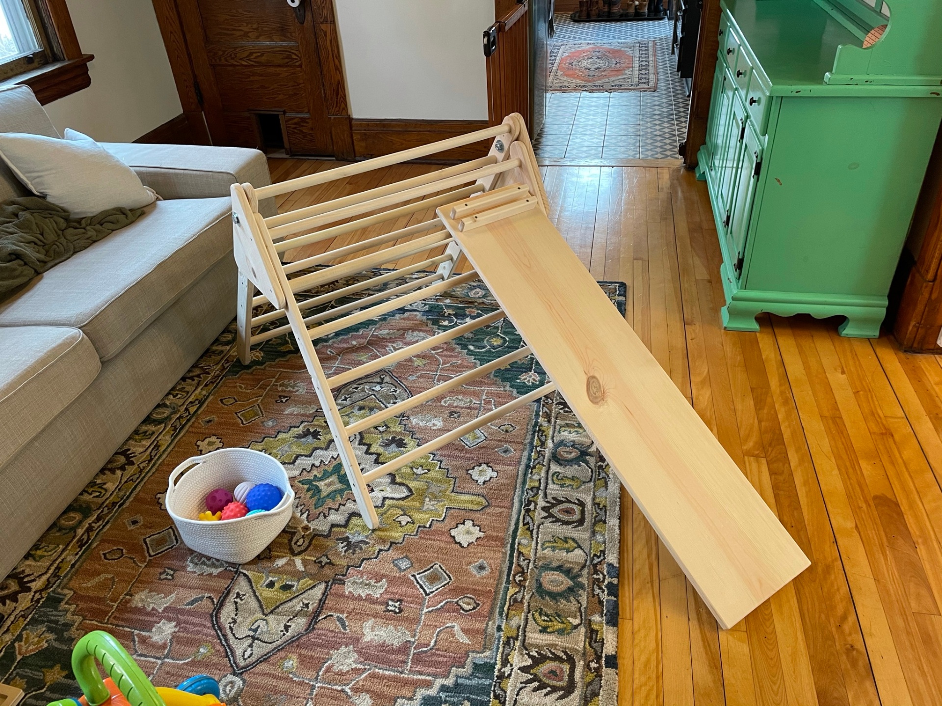 Wooden Pikler triangle with attached climbing ramp